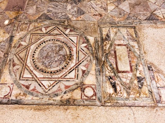 Particular of the polychrome opus sectile of the room with the three-light window in the Domus of Nymphaeum located archaeological excavations of Ostia Antica in Rome